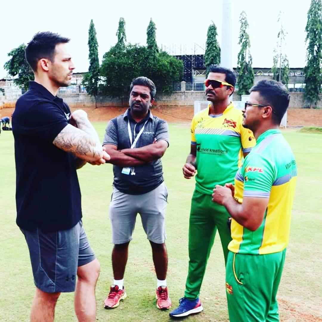 mitchell johnson chatting with our coaches 